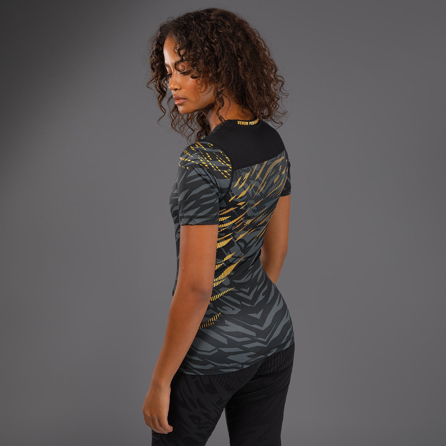 UFC Fusion by Venum Authentic Fight Night Women’s Performance Short Sleeve Rashguard - Champion