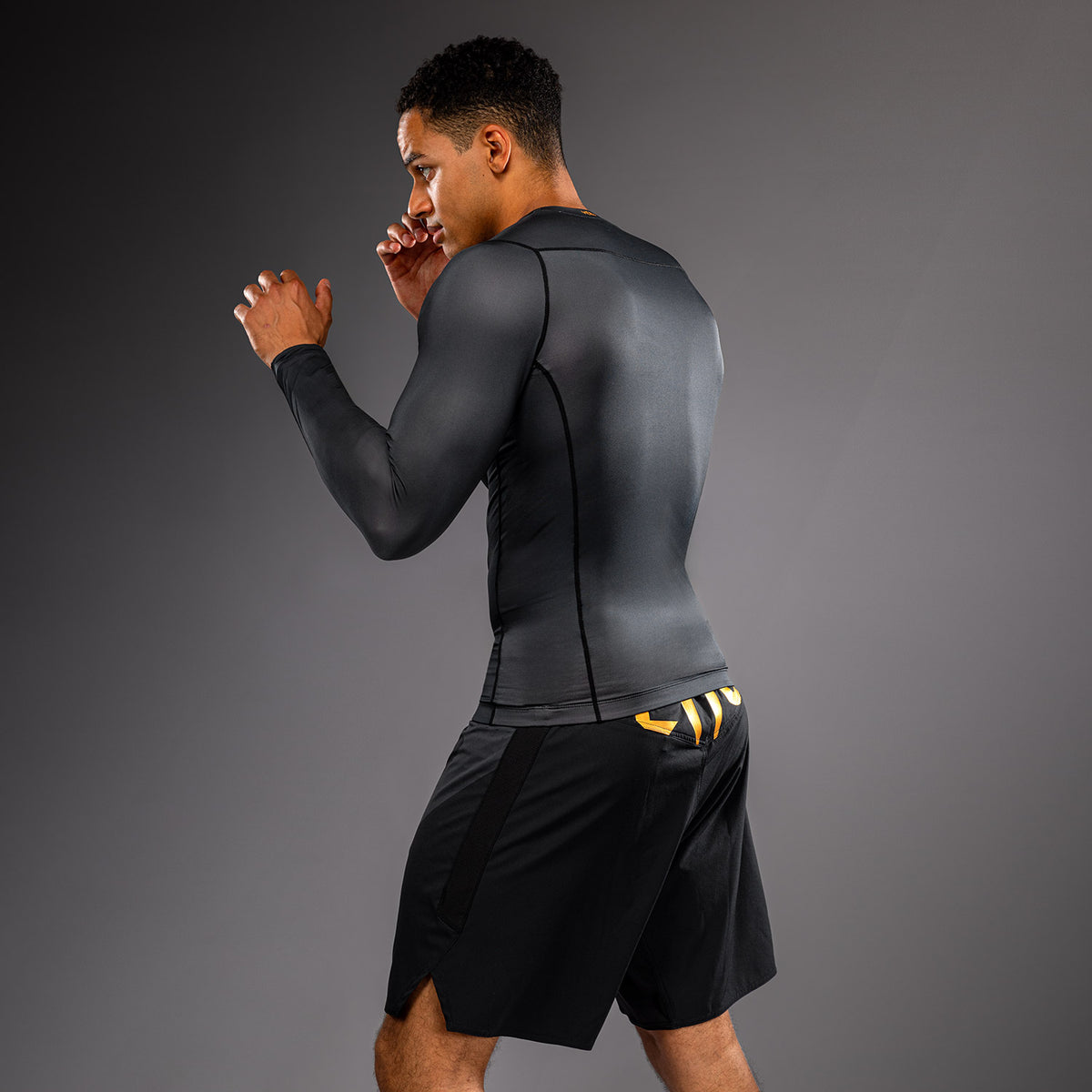 Venum Attack Long Sleeve Rashguard - Black/Gold